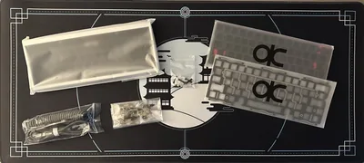 QK60 R2 keyboard kit in E-Ice white and black with PVD dusk weight